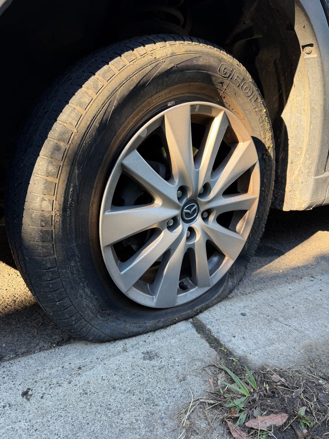 Mazda tyre popped after hitting the gutter, before replacement in Campbelltown