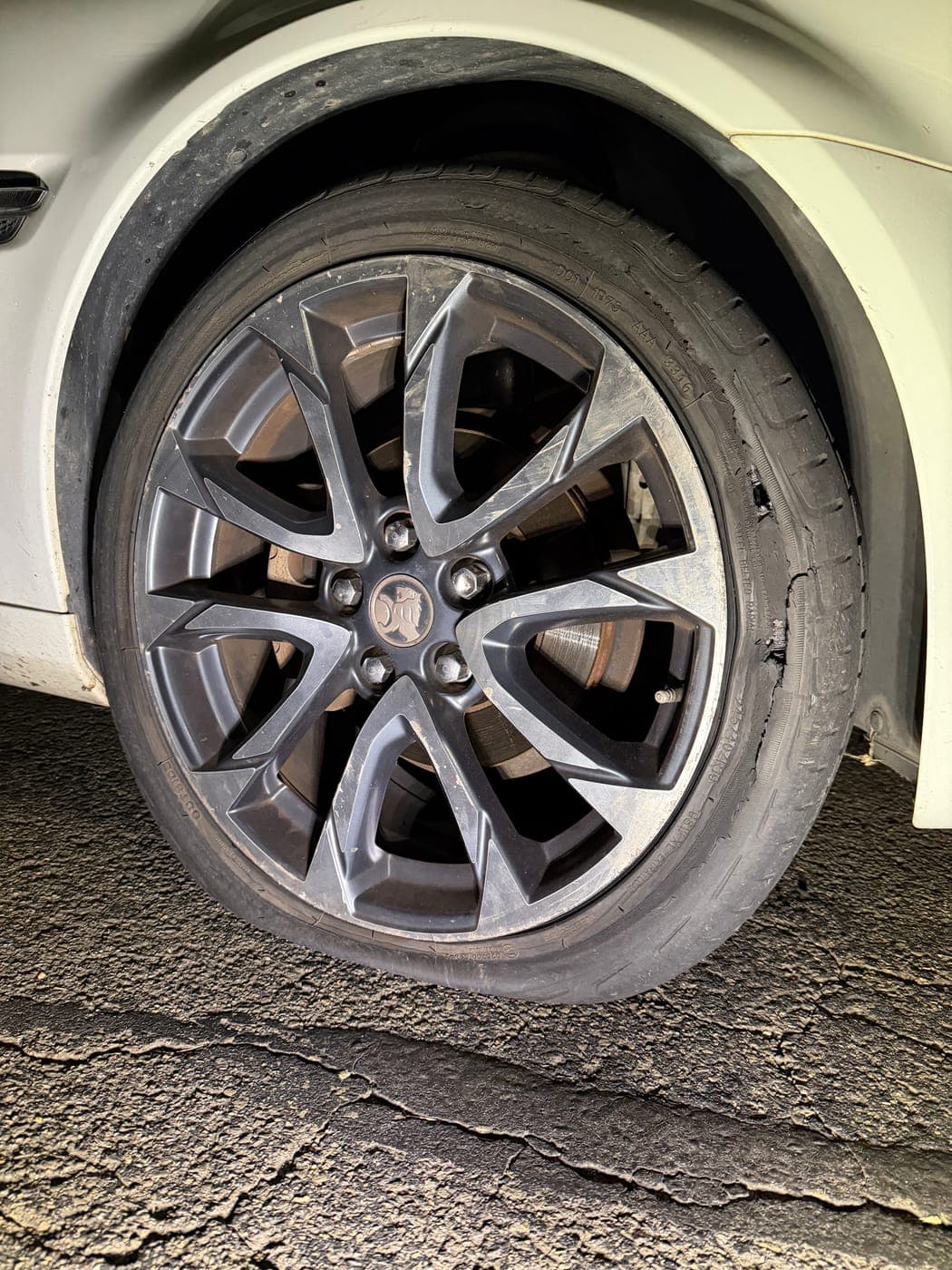 Worn Holden Commodore tyre before an after-hours replacement in Glenmore Park