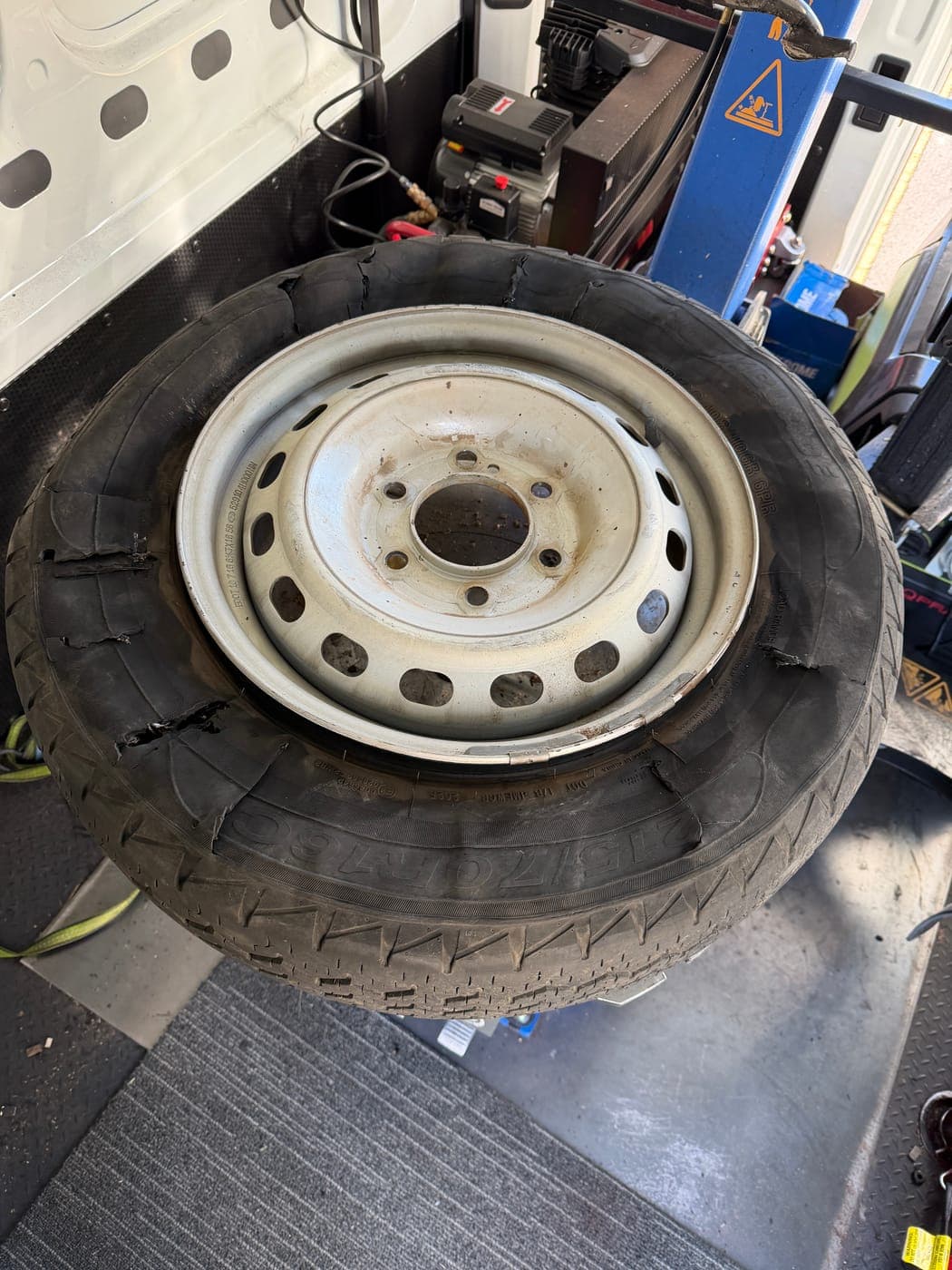 Hyundai iLoad van tyre destroyed by a blowout on The Northern Road, Luddenham, before replacement