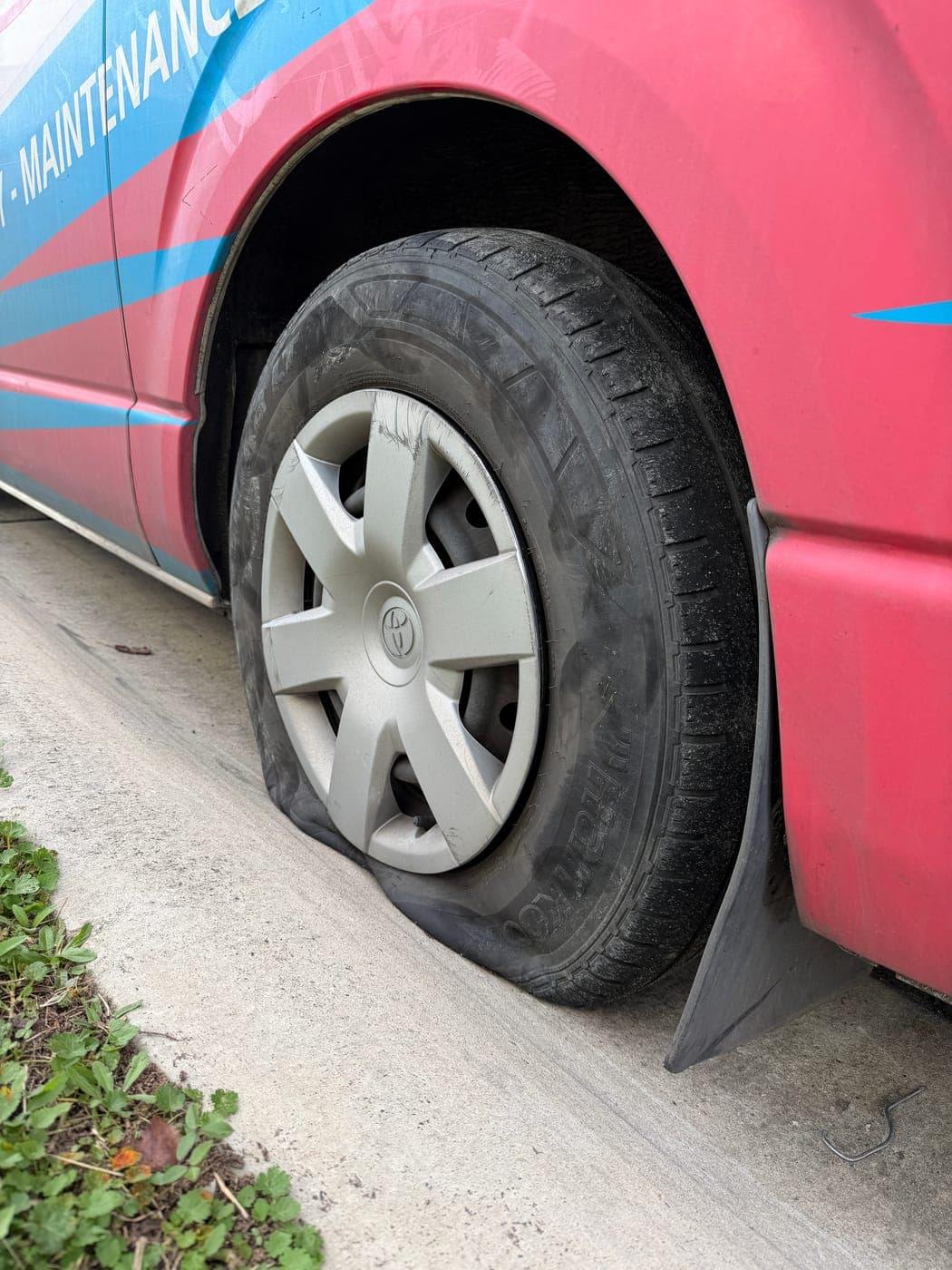 Blown rear tyre on a Toyota HiAce van before replacement in Marsden Park