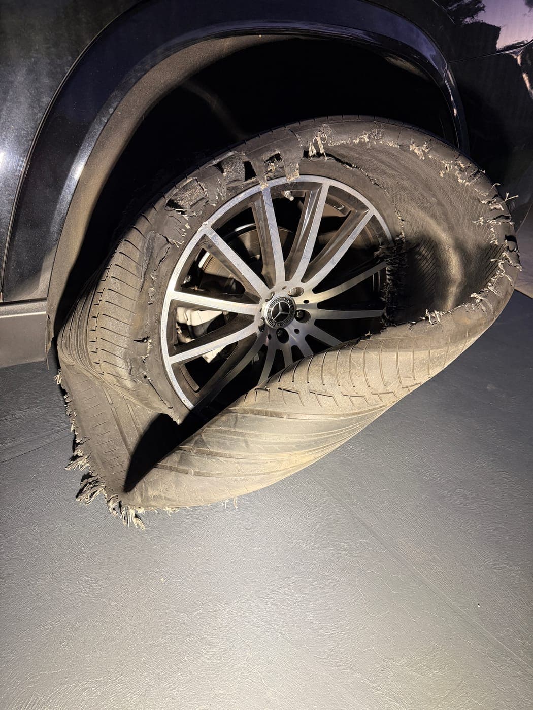 Mercedes SUV tyre folded and destroyed by a blowout in Minto, before an after-hours replacement