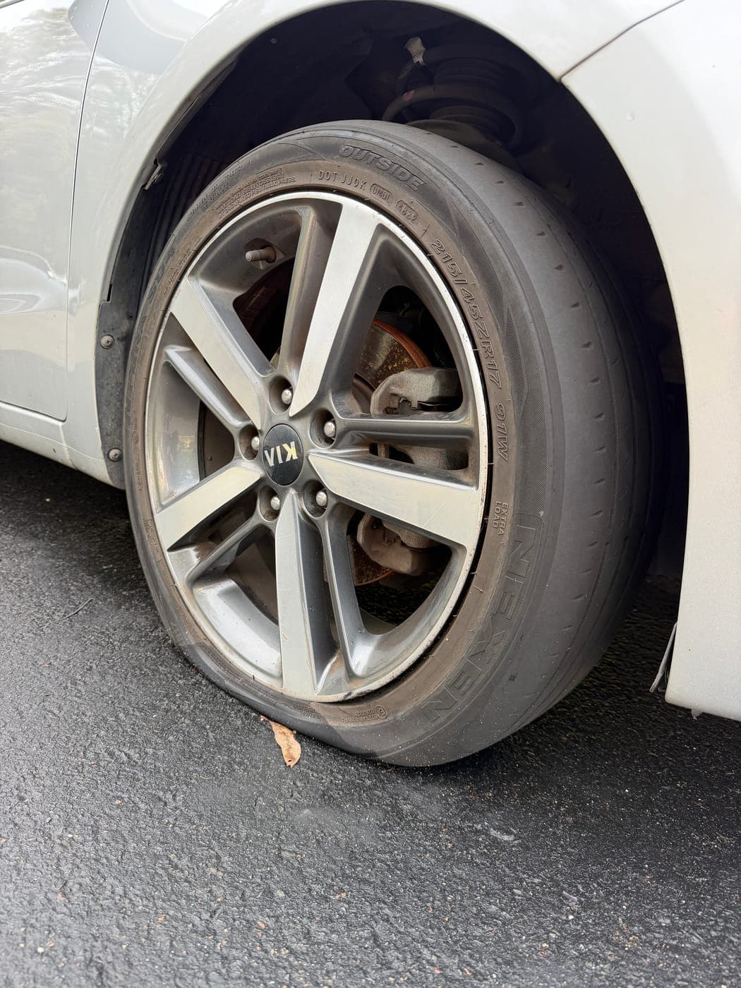 Worn-out tyre on a Kia Cerato before replacement in Ropes Crossing