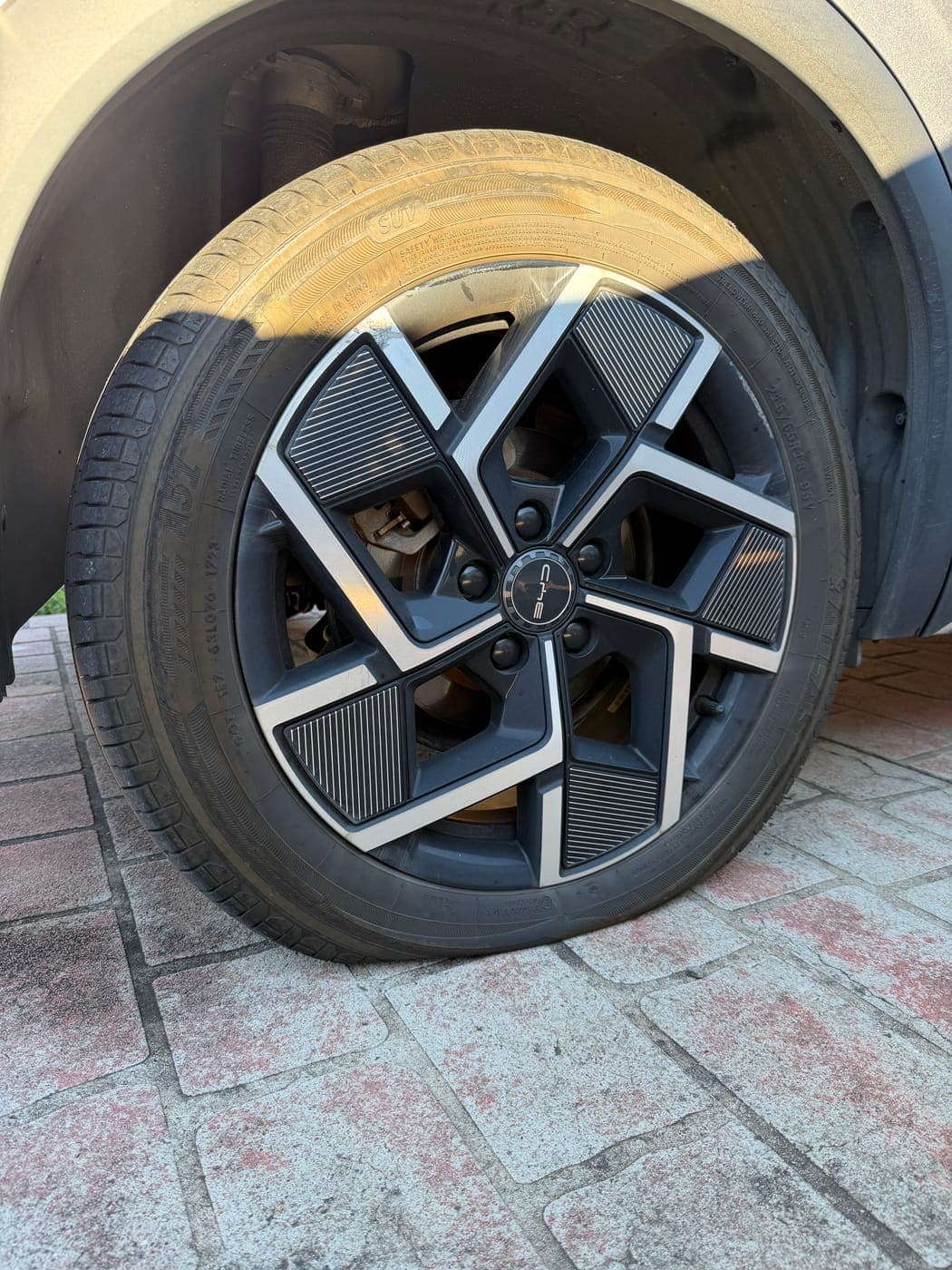 Kerb-damaged blown tyre on a BYD before replacement in Rosemeadow