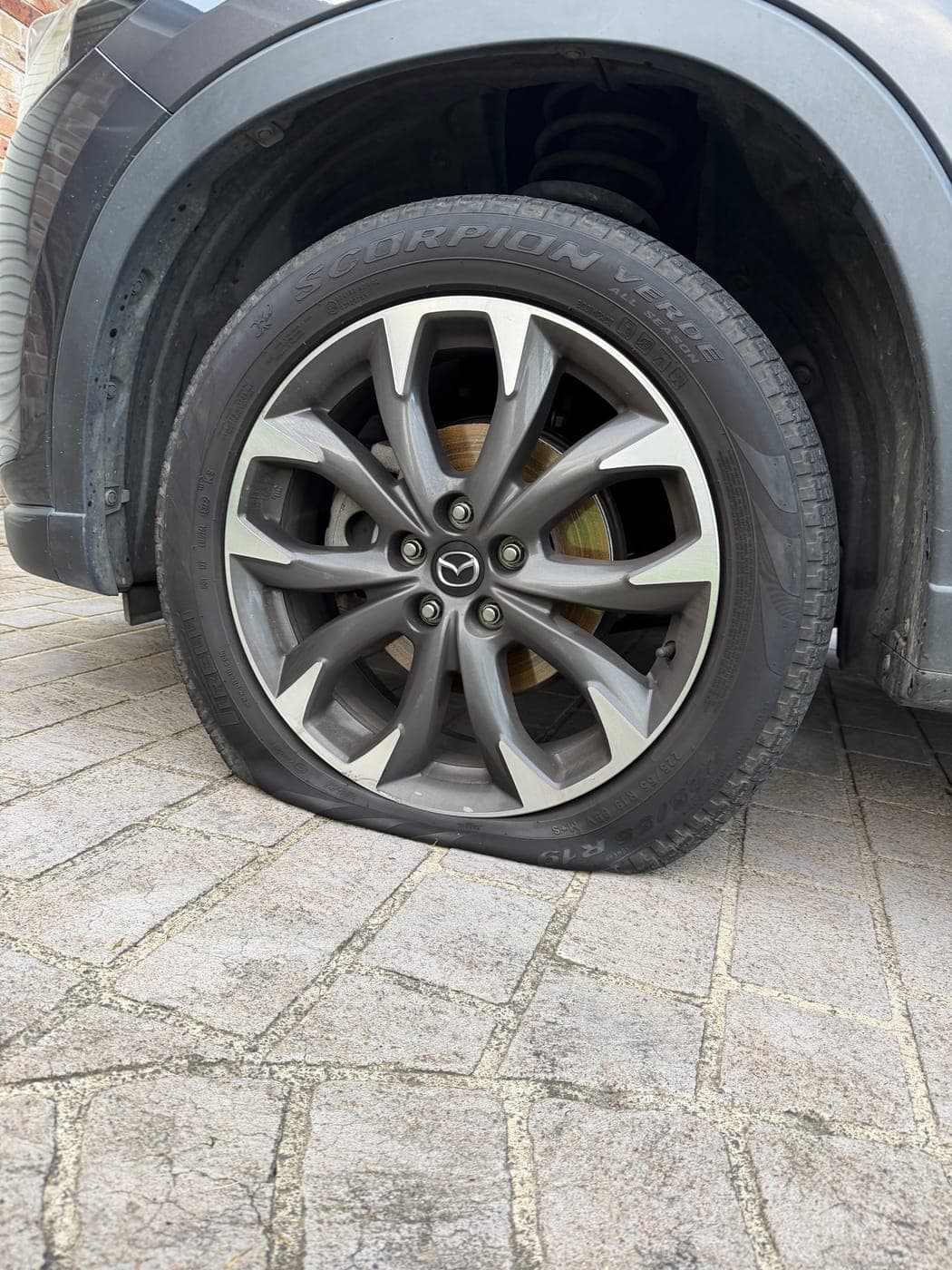 Mazda CX-5 tyre with unrepairable pothole damage before replacement in The Oaks