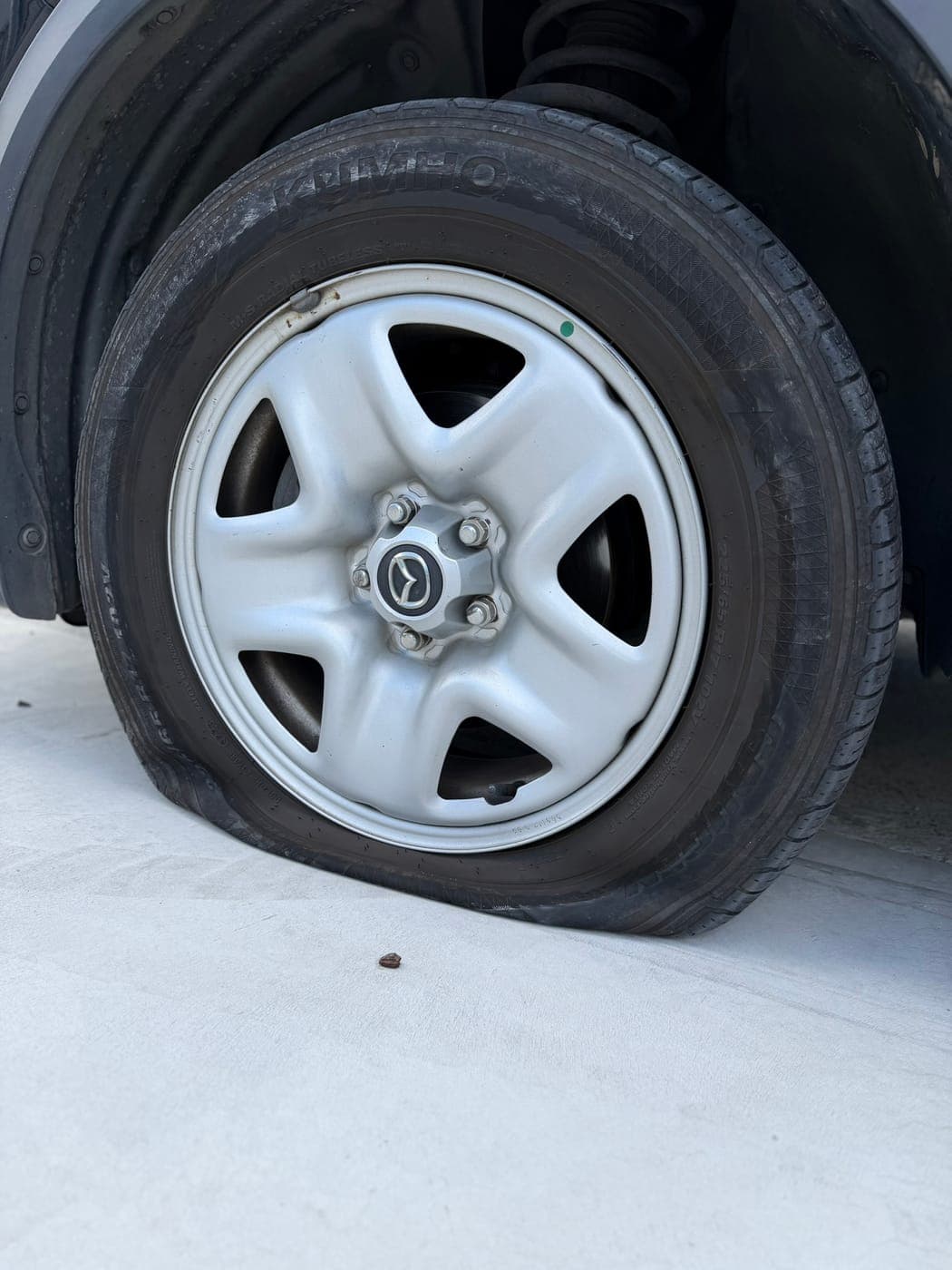 Flat Mazda CX-5 tyre after being driven on low pressure in Unanderra, before replacement